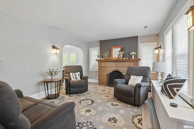 850 27th St, Rock Island, IL 61201 - living room featuring arched walkways and a fireplace