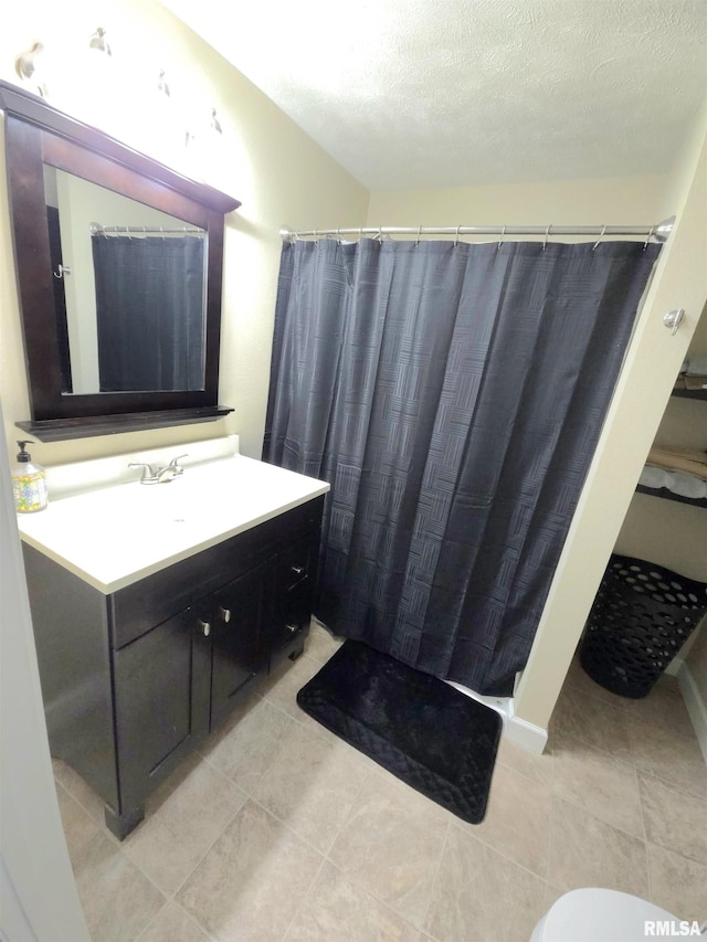 1401 Glopen Rd, Carbondale, IL 62901 - full bath with vanity, a textured ceiling, tile patterned flooring, and a shower with curtain