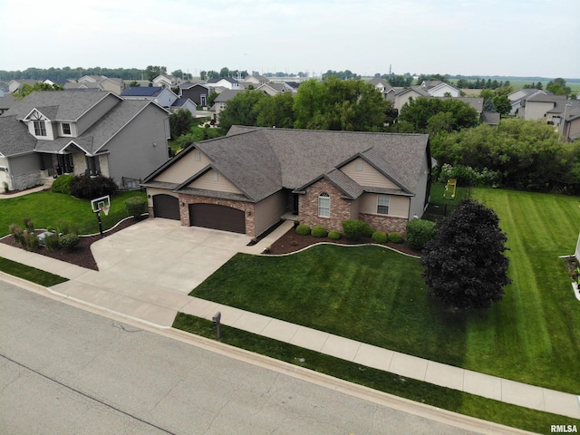 10509 N Butterfly Dr, Dunlap, IL 61525 - view of front of house featuring a garage, a residential view, and a front lawn