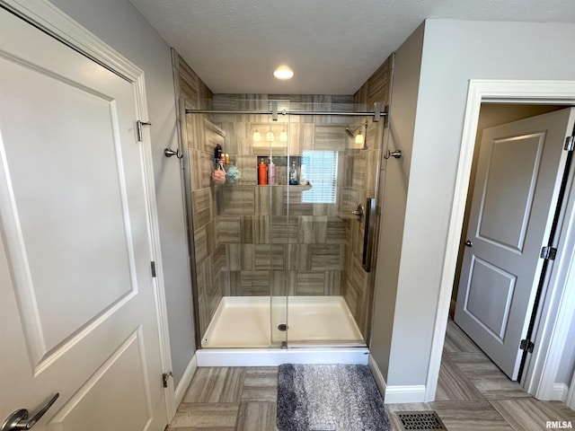10509 N Butterfly Dr, Dunlap, IL 61525 - bathroom with a stall shower and baseboards