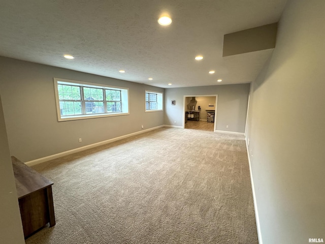 10509 N Butterfly Dr, Dunlap, IL 61525 - basement with carpet floors, recessed lighting, and plenty of natural light