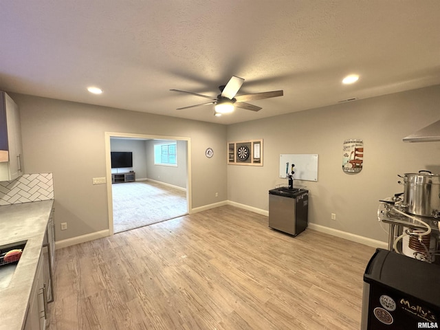 10509 N Butterfly Dr, Dunlap, IL 61525 - interior space featuring ceiling fan, light wood-style floors, recessed lighting, a fireplace, and a textured ceiling