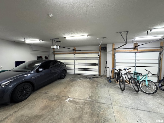 10509 N Butterfly Dr, Dunlap, IL 61525 - garage featuring a garage door opener
