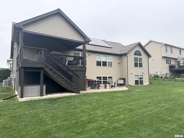 10509 N Butterfly Dr, Dunlap, IL 61525 - rear view of property featuring roof mounted solar panels, stairway, a patio, a deck, and roof with shingles