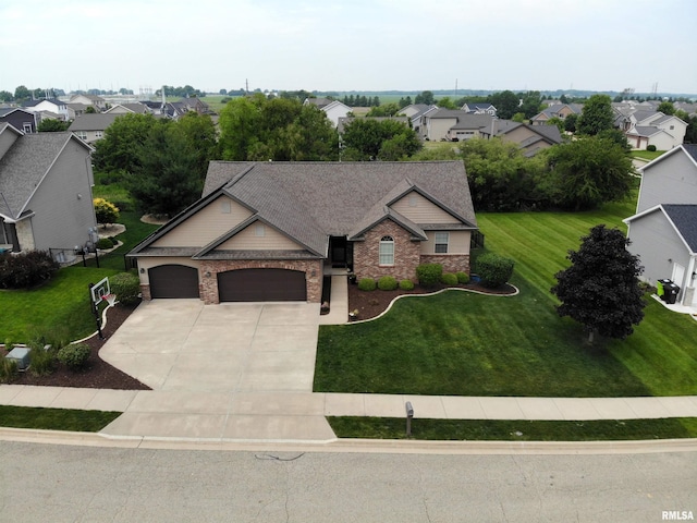 10509 N Butterfly Dr, Dunlap, IL 61525 - view of front of home featuring driveway, a garage, a front lawn, a residential view, and stone siding