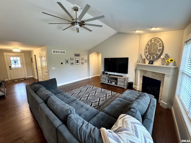 10509 N Butterfly Dr, Dunlap, IL 61525 - living room with ceiling fan, arched walkways, lofted ceiling, dark wood finished floors, and a fireplace