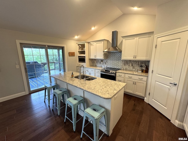10509 N Butterfly Dr, Dunlap, IL 61525 - kitchen featuring wall chimney exhaust hood, stainless steel range with electric stovetop, dark wood-style floors, a breakfast bar, and lofted ceiling