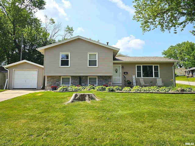 315 Colony Dr, Davenport, IA 52806 - tri-level home featuring an outbuilding, a front lawn, concrete driveway, a detached garage, and stone siding