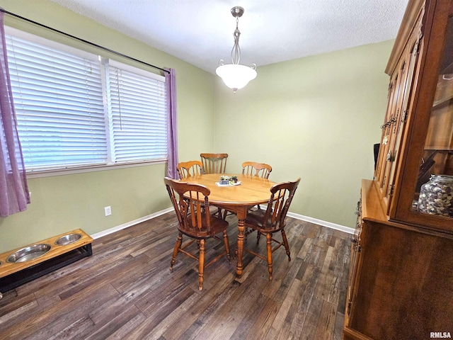 315 Colony Dr, Davenport, IA 52806 - dining space featuring dark wood-style flooring and a textured ceiling