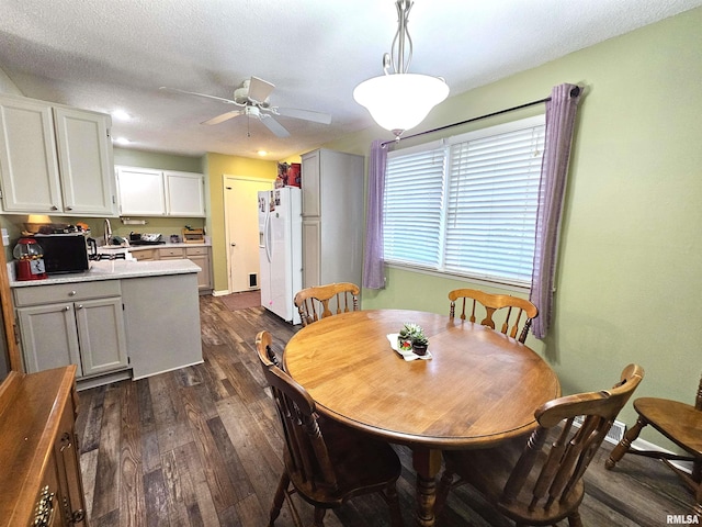 315 Colony Dr, Davenport, IA 52806 - dining room featuring dark wood-type flooring and a ceiling fan