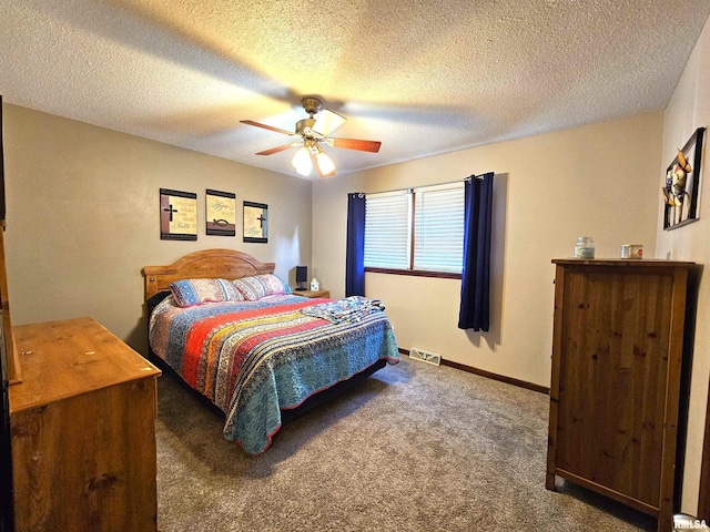 315 Colony Dr, Davenport, IA 52806 - carpeted bedroom featuring a ceiling fan and a textured ceiling
