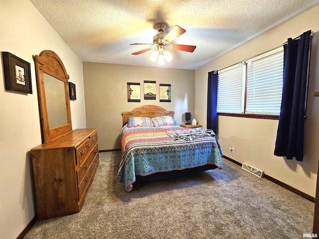 315 Colony Dr, Davenport, IA 52806 - bedroom featuring a textured ceiling, carpet flooring, and ceiling fan