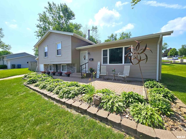315 Colony Dr, Davenport, IA 52806 - tri-level home with a front yard and a patio