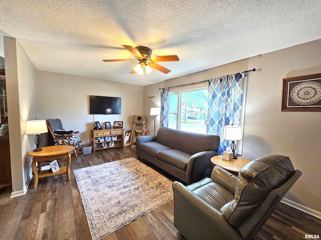 315 Colony Dr, Davenport, IA 52806 - living room with ceiling fan, dark wood-style flooring, and a textured ceiling