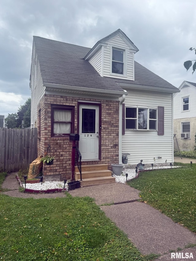 129 S Birchwood Ave, Davenport, IA 52802 - view of front of house with roof with shingles, brick siding, and entry steps
