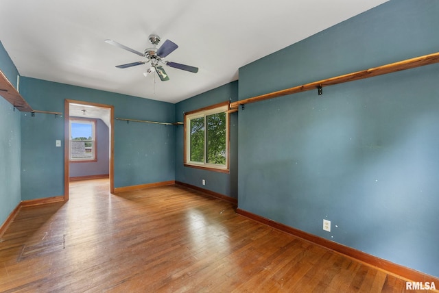 204 E Main St, Joy, IL 61260 - unfurnished room with healthy amount of natural light, a ceiling fan, and hardwood / wood-style flooring