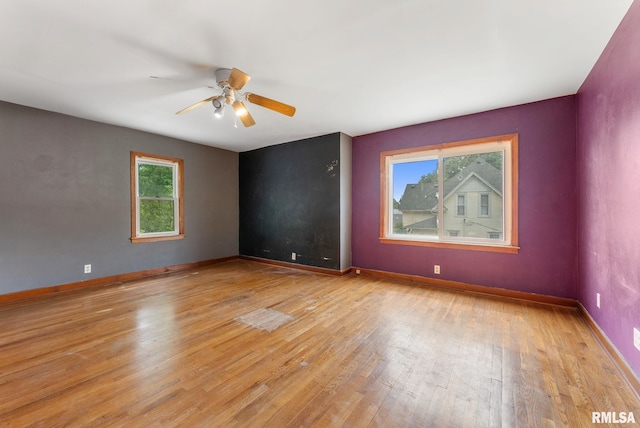 204 E Main St, Joy, IL 61260 - unfurnished room featuring plenty of natural light, ceiling fan, and light wood-style floors