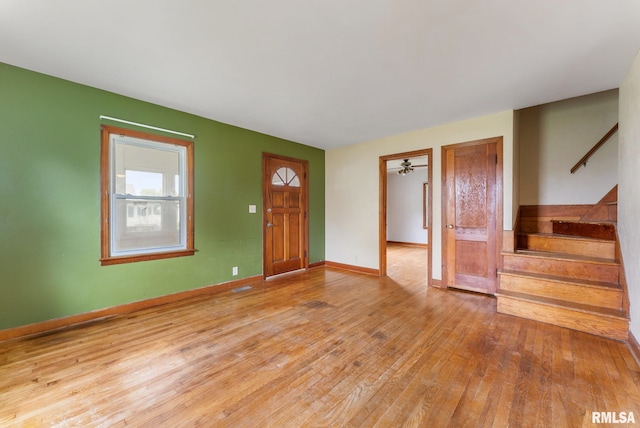 204 E Main St, Joy, IL 61260 - foyer entrance featuring hardwood / wood-style floors and stairway