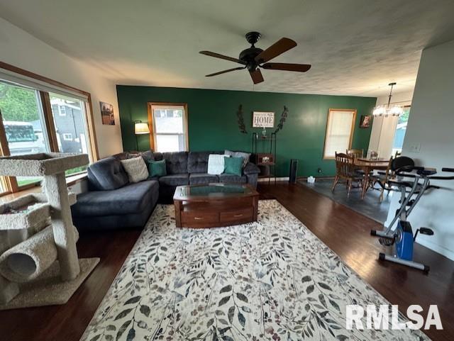 1316 2nd St, Camanche, IA 52730 - living area featuring wood finished floors, a ceiling fan, and plenty of natural light