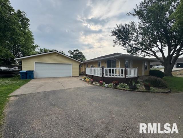1316 2nd St, Camanche, IA 52730 - ranch-style home with a detached garage and an outdoor structure
