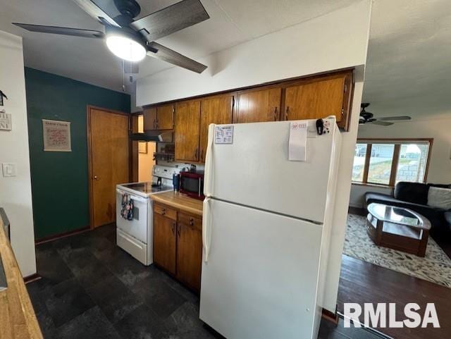 1316 2nd St, Camanche, IA 52730 - kitchen with white appliances, ceiling fan, brown cabinetry, and under cabinet range hood
