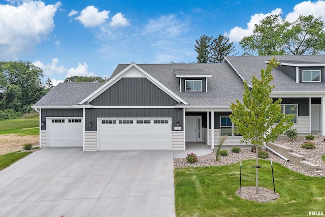 1354 Heights Ct, Bettendorf, IA 52722 - view of front of home with roof with shingles, driveway, an attached garage, and board and batten siding
