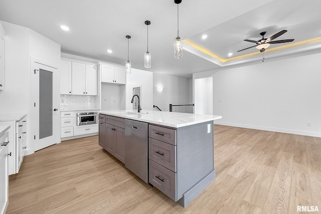1354 Heights Ct, Bettendorf, IA 52722 - kitchen with dishwasher, light wood-style flooring, white cabinetry, ceiling fan, and recessed lighting