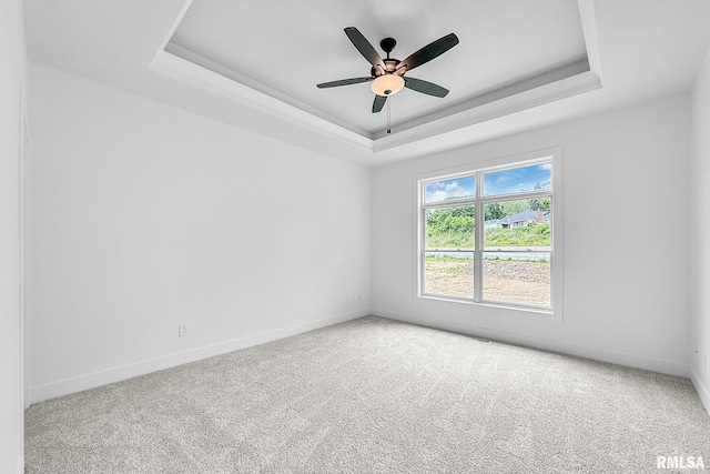 1354 Heights Ct, Bettendorf, IA 52722 - carpeted empty room with a tray ceiling and a ceiling fan