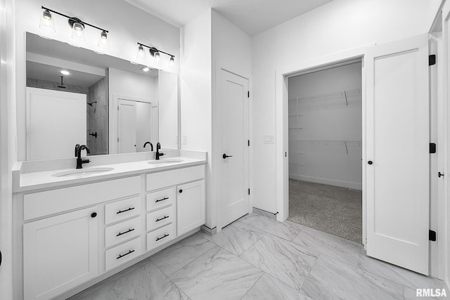 1354 Heights Ct, Bettendorf, IA 52722 - bathroom featuring a tile shower, double vanity, marble look tile flooring, and a spacious closet