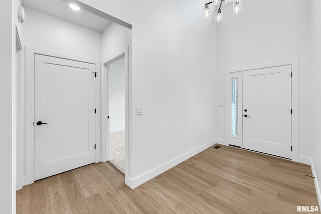 1354 Heights Ct, Bettendorf, IA 52722 - foyer entrance with light wood-style floors and baseboards
