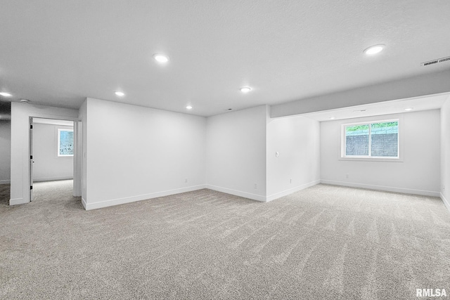 1354 Heights Ct, Bettendorf, IA 52722 - empty room featuring recessed lighting, light carpet, and healthy amount of natural light