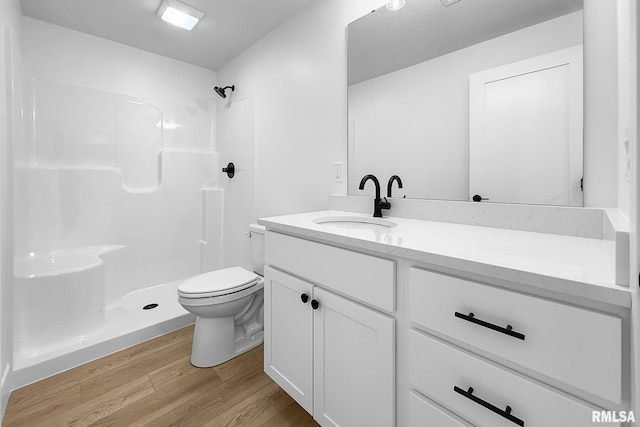 1354 Heights Ct, Bettendorf, IA 52722 - full bath with wood finished floors, vanity, and a shower