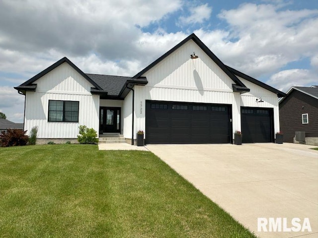 1722 17th St, De Witt, IA 52742 - modern farmhouse style home featuring a garage, concrete driveway, and a front yard