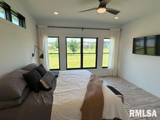 1722 17th St, De Witt, IA 52742 - bedroom featuring light wood-type flooring, recessed lighting, and a ceiling fan
