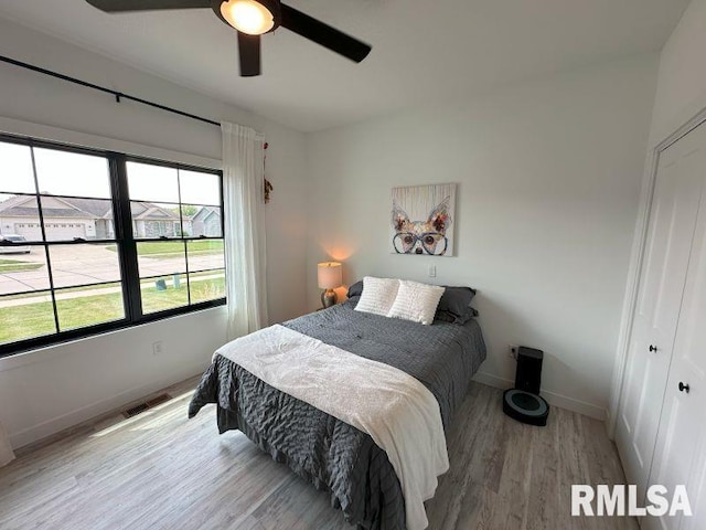 1722 17th St, De Witt, IA 52742 - bedroom featuring wood finished floors and ceiling fan