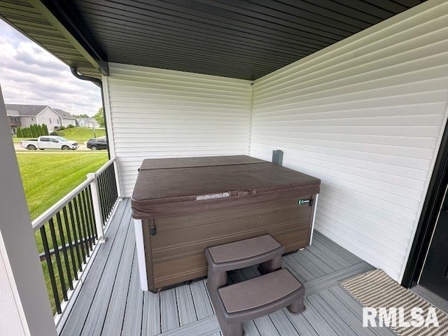 1722 17th St, De Witt, IA 52742 - deck with a hot tub and a lawn