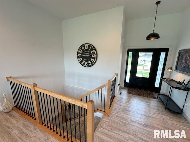 1722 17th St, De Witt, IA 52742 - foyer with wood finished floors and vaulted ceiling