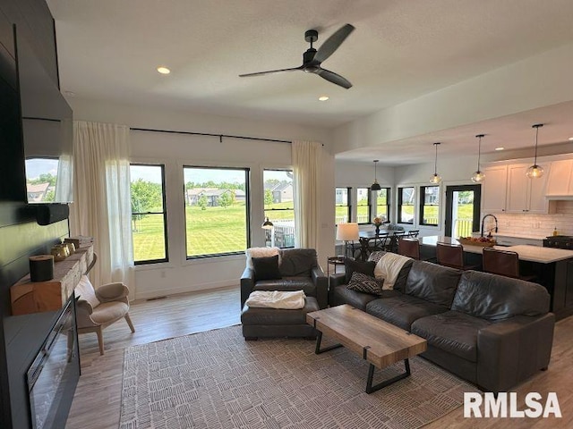 1722 17th St, De Witt, IA 52742 - living room with ceiling fan, recessed lighting, and light wood-style floors