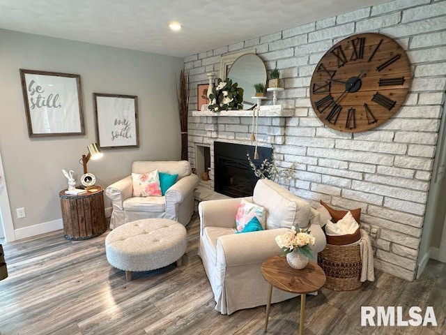 1144 Brookview Dr, De Witt, IA 52742 - living room featuring a fireplace and wood finished floors