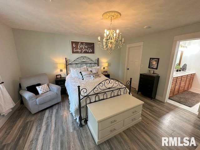 1144 Brookview Dr, De Witt, IA 52742 - bedroom featuring a chandelier and dark wood-style flooring