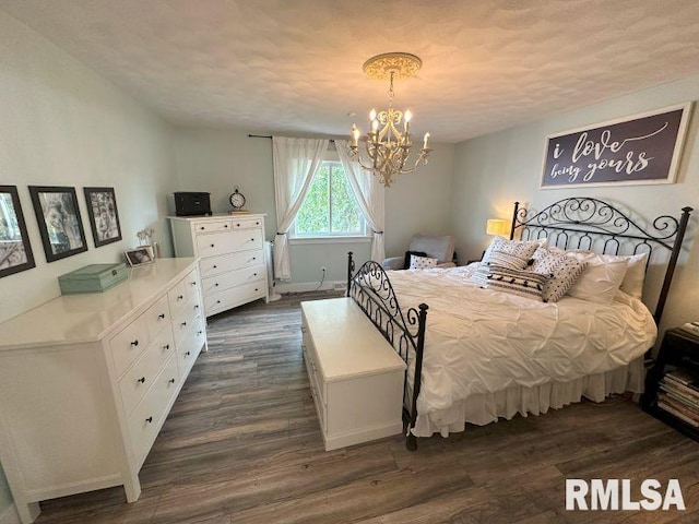 1144 Brookview Dr, De Witt, IA 52742 - bedroom featuring a chandelier and dark wood-style flooring
