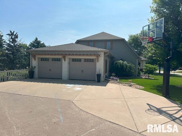 1144 Brookview Dr, De Witt, IA 52742 - view of front of property with a garage and driveway