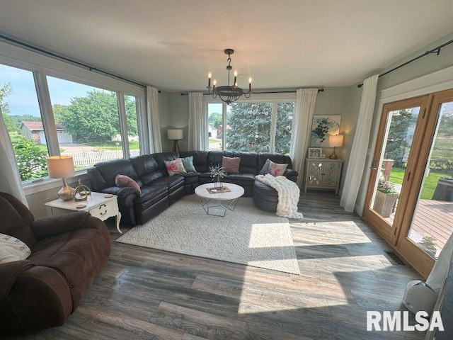 1144 Brookview Dr, De Witt, IA 52742 - living room with a chandelier, healthy amount of natural light, and wood finished floors