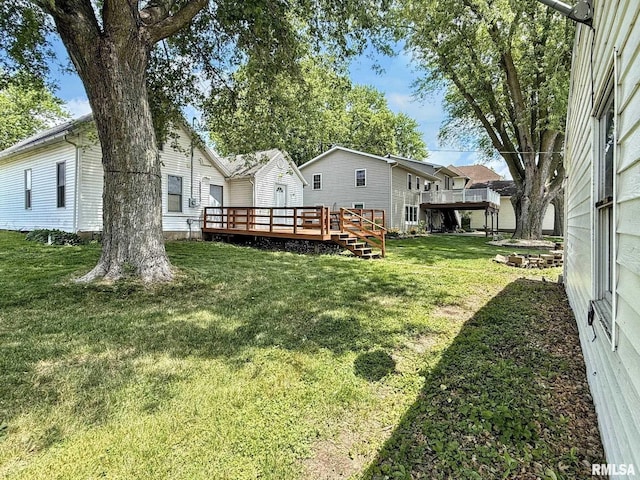 511 Fulton St, Grand Mound, IA 52751 - view of green lawn featuring a deck
