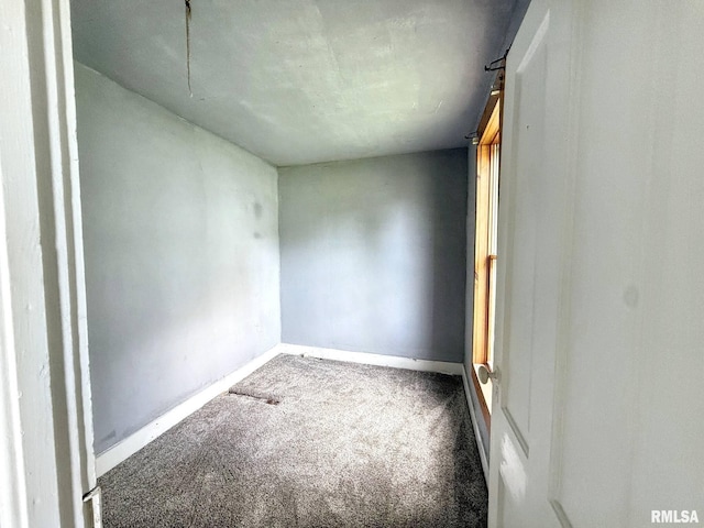 511 Fulton St, Grand Mound, IA 52751 - carpeted empty room with baseboards