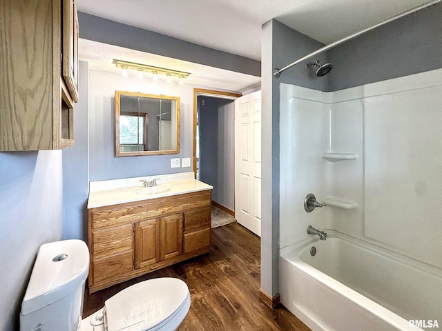 511 Fulton St, Grand Mound, IA 52751 - bathroom with wood finished floors, bathtub / shower combination, and vanity