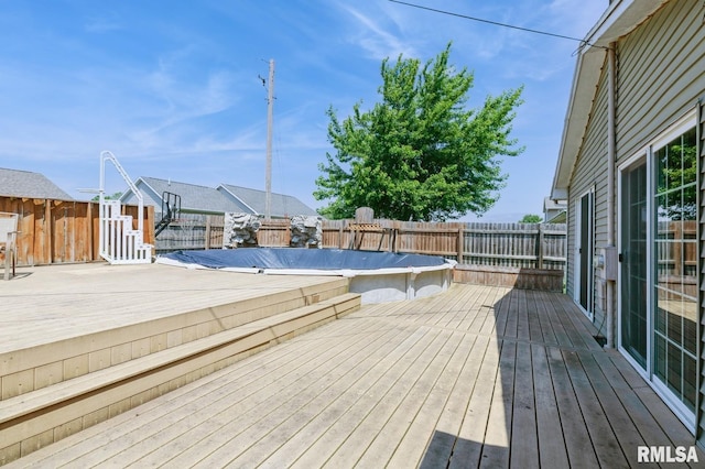 1445 Lawrence Ave, Camanche, IA 52730 - wooden deck featuring a fenced backyard