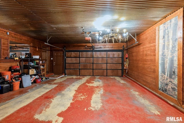 1445 Lawrence Ave, Camanche, IA 52730 - garage with wooden walls and a garage door opener