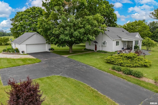 13524 US Route 67, Milan, IL 61264 - view of front of home featuring an outbuilding, a front lawn, and a garage