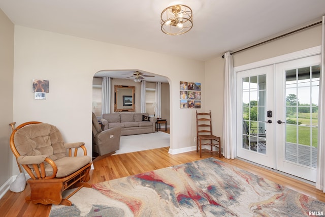 13524 US Route 67, Milan, IL 61264 - living room featuring arched walkways, wood finished floors, and french doors
